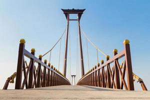 Beautiful bridge against blue sky background photo