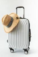 white luggage hat travel journey to destination long weekend holiday photo