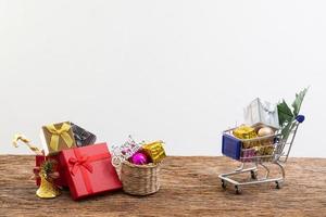 shopping cart present box with color ribbon on white background photo