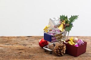 shopping cart present box with color ribbon on white background photo