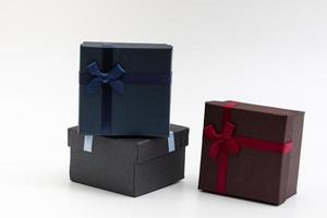 present box with color ribbon on white background photo