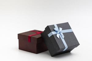 present box with color ribbon on white background photo