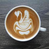 Top view of a mug of latte art coffee. photo