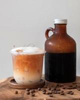 Ice coffee drink with foam and coffee beans photo