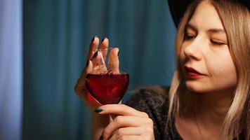 Cropped image of woman holding heart shaped glass jar of love potion photo