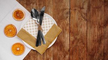 Overhead view of fall table setting over wooden table with copy space photo