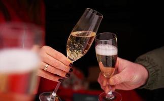 Dating concept - close up of champagne glasses photo