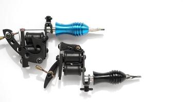 Two tattoo machines on a white background - space for text photo