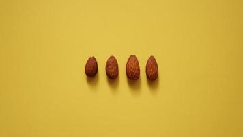 The four almonds on yellow background