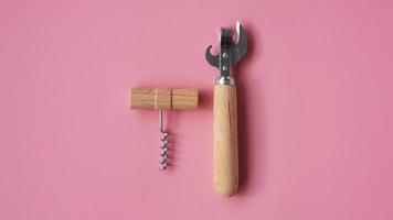 Wooden corkscrews and tin opener photo
