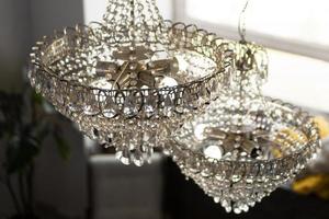 Beautiful crystal chandelier in a room photo