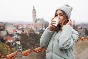 Female tourist against the background of town in the Czech photo