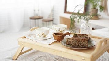 Breakfast set close up in the room. Cups on a tray photo