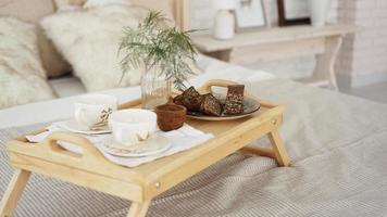 Breakfast set close up in the room. Cups on a tray photo