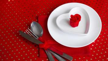 Romantic decoration of holiday table - Red background photo