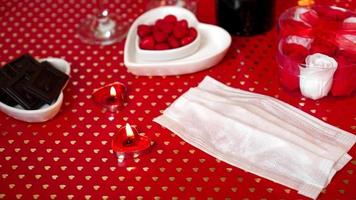 Valentines day concept table. romantic dinner with medical mask photo