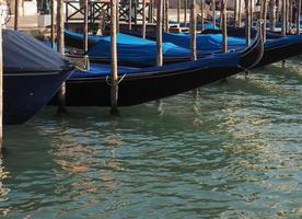 Gondola rowing boat in Venice photo