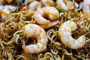 Roasted noodles with shrimps and garlic photo