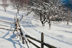 snow-capped fence countryside winter sunny landscape photo