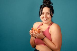 Happy plus size positive woman in studio photo