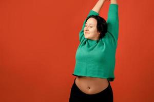 Happy plus size positive woman in studio photo