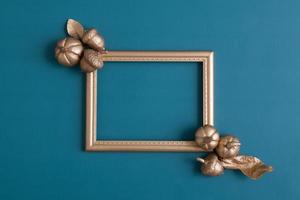 Golden frame flat lay with pumpkins photo