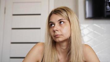 Portrait of young woman with frowning and looking upward photo