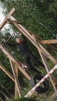 Man passing through hurdles during obstacle course in boot camp photo