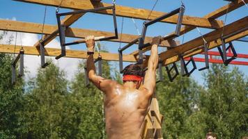 Man passing through hurdles during obstacle course in boot camp photo