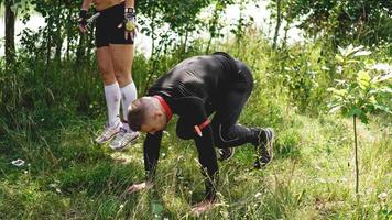 Sport competitions, nature. Men exercise photo