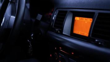 Buttons of radio, dashboard, climate control in car close up photo