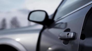 Color horizontal shot of a dark silver car door handle photo