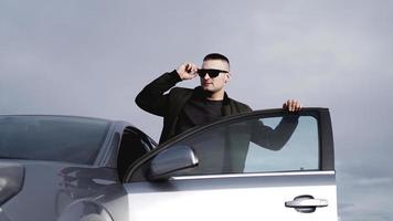 Handsome man near the car. Luxury life. photo