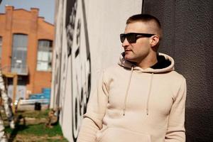 Hipster man in the street in summer day. photo