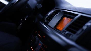 Buttons of radio, dashboard, climate control in car close up photo