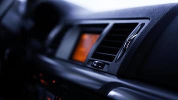 Buttons of radio, dashboard, climate control in car close up