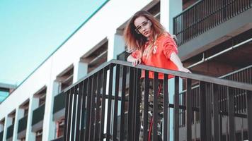 Fashion model wearing red hoodie with inscription los angeles photo