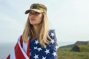 Civilian woman in her husband's military cap photo