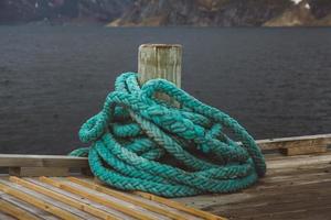 Spriral natical rope at a wooden pier photo