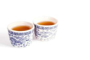 Chinese tea cups on white background photo