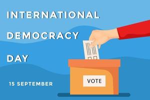 banner del día internacional de la democracia. mano poniendo en papel voto a la caja
