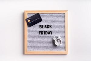 Text black friday on gray letter board on white background photo