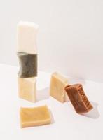 Stack of hand made soap on white background photo