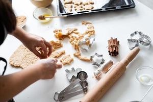 Woman hands baking cookies at the kitchen photo