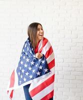 Beautiful young woman with American flag photo