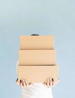 Woman holding blank boxes photo