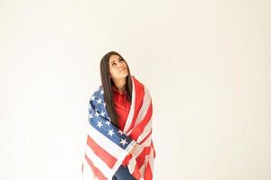 Beautiful young funny woman with American flag photo