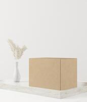 Box and vase of flowers placed on a wooden plinth photo