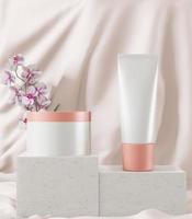 Cream jar and squeeze tube on pastel pink background. photo