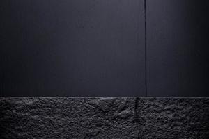 Dark stone on Dark wooden table. Top view with Copy space photo